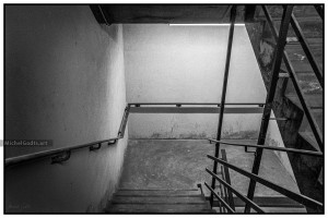 Ominous Stairwell Descent :: Black and white fine art photograph - Artwork © Michel Godts