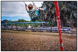 Swing Fun Over Train :: Documentary fine art photograph - Artwork © Michel Godts