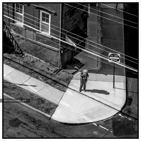 Street Corner Phone Call :: Black and white urban street photography - Artwork © Michel Godts